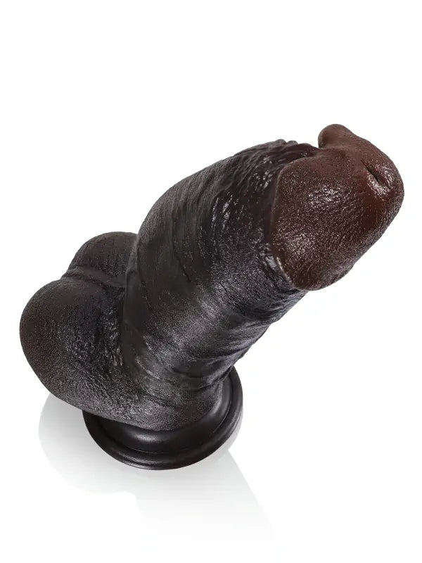 8 inch thick black dildo on a suction base, side view