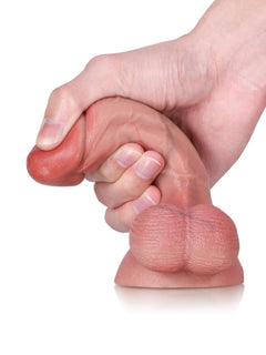 Finger squeezing Bayou soft cone-shaped glans to show its gentle give