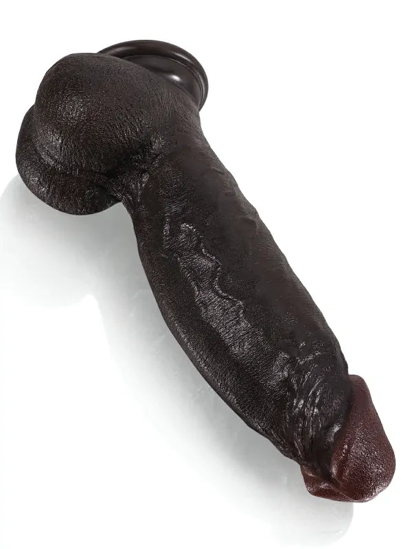 Black dildo on its suction cup base for hands-free play