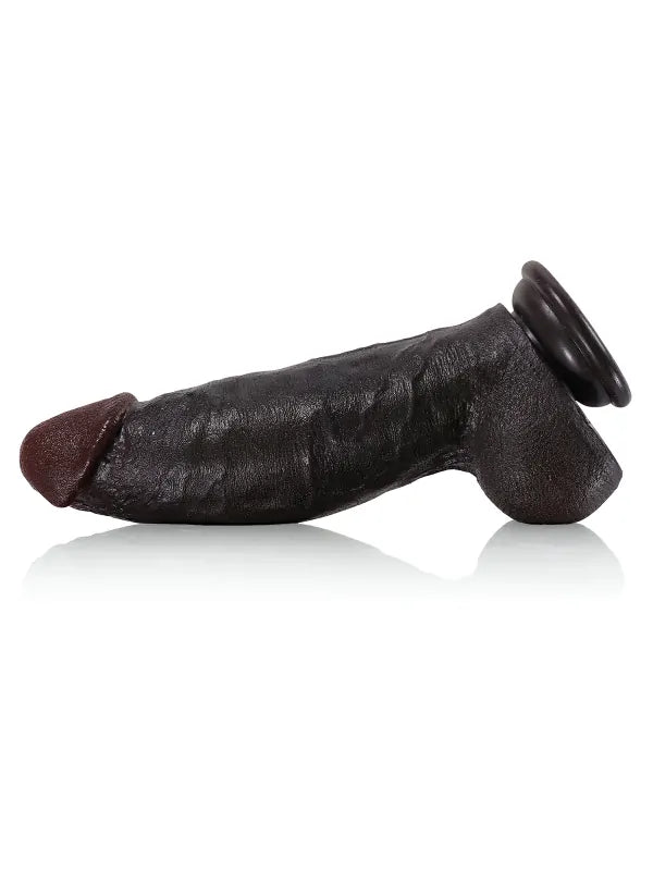 Black realistic dildo with full balls, angled view