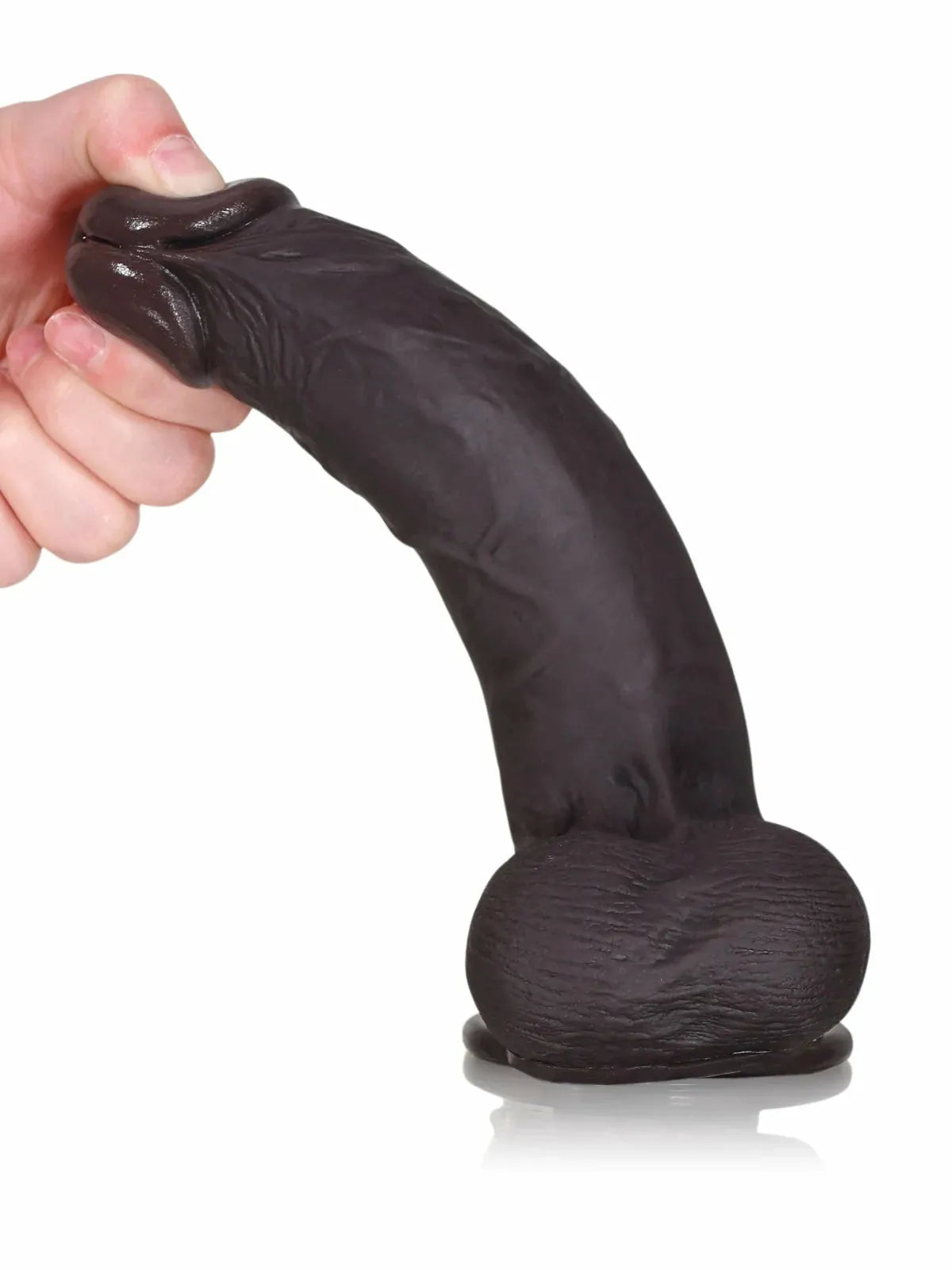 Hand displaying black cyberskin dildo with realistic skin movement