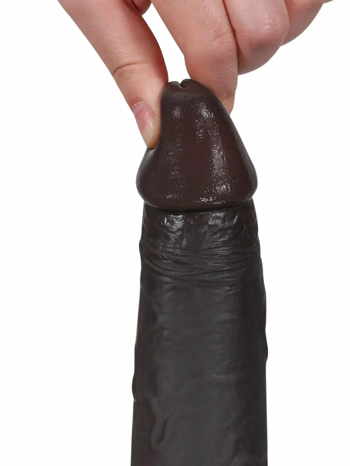 Close-up of black cyberskin dildo glans and skin detail