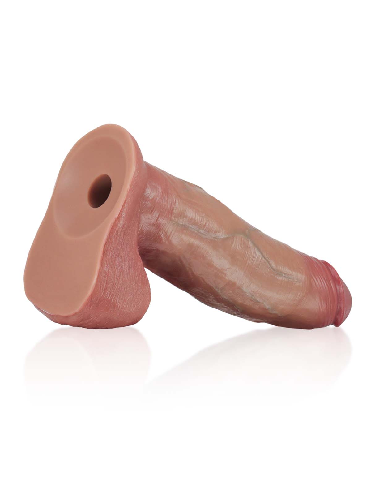 Brown sliding skin dildo lying on its Vac-U-Lock suction base