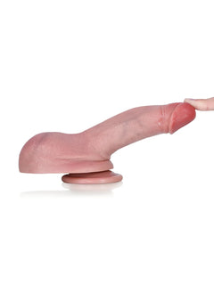 Small flesh dildo on its suction base for hands-free play